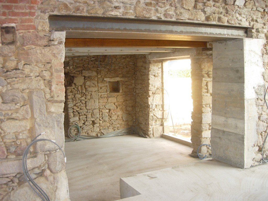 Ouverture de mur en pierre, en béton à Cergy